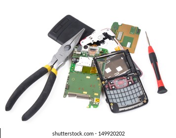 Broken Cell Phone In Pieces With Tools