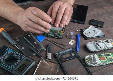 Broken Cell Phone Repair. Smartphone Parts And Tools For Recovery, Selective Focus