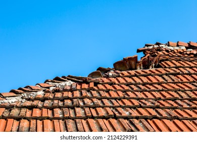 Broken Ceramic Roof Tile, Blue Sky Without Clouds In Background