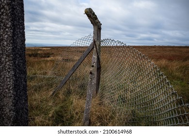 Broken Chain Link Fence And Concrete Fence Post