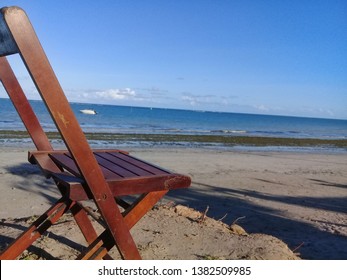 Broken Chair On The Beach