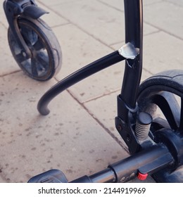 Broken Chassis Of A Baby Stroller, Damage To The Crossbar Of The Metal Frame Of The Pram