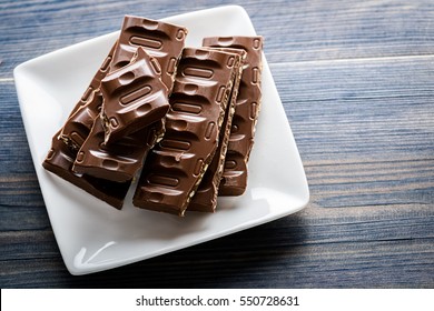 Broken Chocolate Bar With Nuts And Coffe