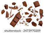 Broken chocolate bar pieces falling on isolated white background. Milk Chocolate explosion with  cocoa crumbs and shavings,  Top view. Flat lay. Pattern

