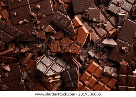 Broken chocolate bar texture background