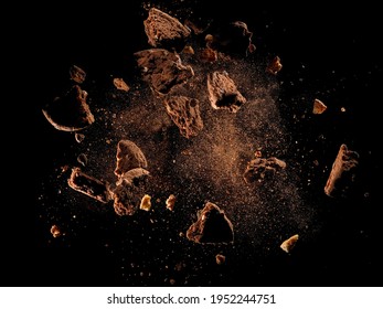 Broken chocolate cookies explosion on black background - Shutterstock ID 1952244751