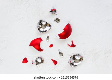 Broken Christmas Ball In The Form Of A Christmas Tree On A Light Background. Horizontal Orientation, Top View.