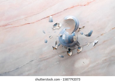 Broken Christmas Light Blue Ball On Marble Floor