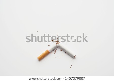 Broken cigarette on white background ,  World No Tobacco Day Tobacco and lung health concept .                       