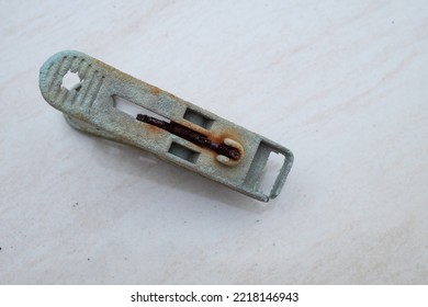 Broken Clothes Pin On A White Background