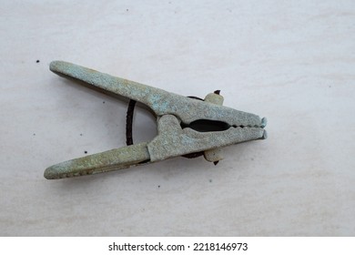 Broken Clothes Pin On A White Background