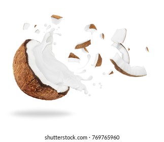 Broken Coconut With Milk Splash, Isolated On White Background 