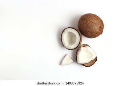 broken coconut on a white background top view.
