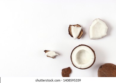 broken coconut on a white background top view.
