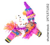 Broken colorful donkey pinata isolated on white background