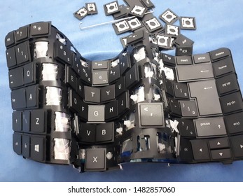 A Broken Computer Keyboard With Loose Keys
