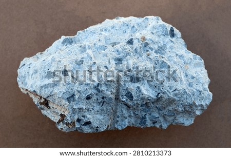 Broken concrete block with visible aggregate stones