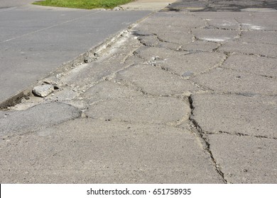 Broken Concrete Sidewalk Needs Repair.