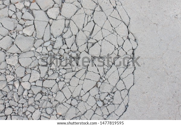 Broken concrete surface background Gray\
skin with cracks Plasters break apart due to impact. Or pedal cars\
The abstract is like the notion of\
politicians.