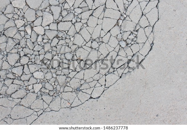 Broken concrete surface background Gray\
skin with cracks Plasters break apart due to impact. Or pedal cars\
The abstract is like the notion of\
politicians.