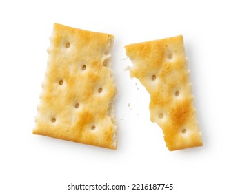 Broken crackers placed on a white background. Viewed from above.