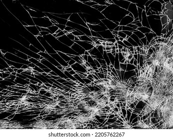 Broken Cracks Glass Fracture Effect Texture Isolated Abstract Black Background. Cracked Pnone Screen With Big Hole Shot. Top View