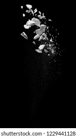 broken debris caused by explosion against black background - Shutterstock ID 1229441128