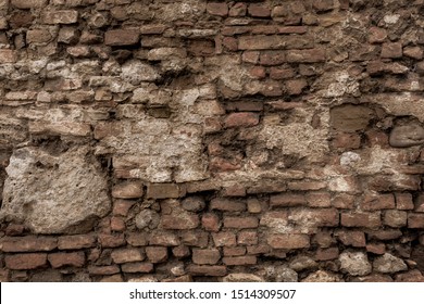 Broken Decay Old Plaster Of Brick Stone Wall Texture. Damaged Erosion Bumpy Gloomy Facade, Chipped Ruined Castle Background. Dirty Horror Dungeon, Muddy Crashed Disaster Exterior For 3d Design 