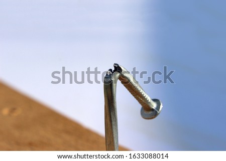 Broken and defective new metal nail closeup. Bent damaged product. Reject expendable material. Stock photo © 