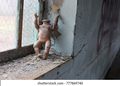 Broken  Doll In Old Abandoned Building