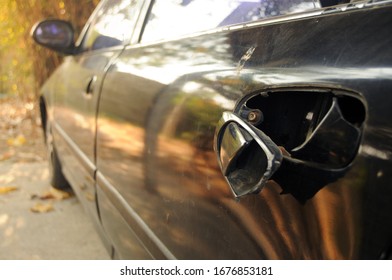 Broken Door Handle Of A Black Car In The Garage.