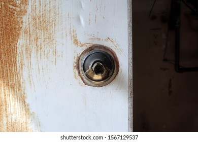 Broken Doorknob On An Old Rusty Door.                               