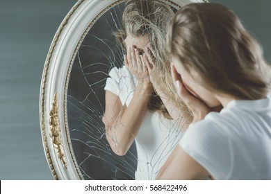 Broken down crying teenager with mental disease - Shutterstock ID 568422496
