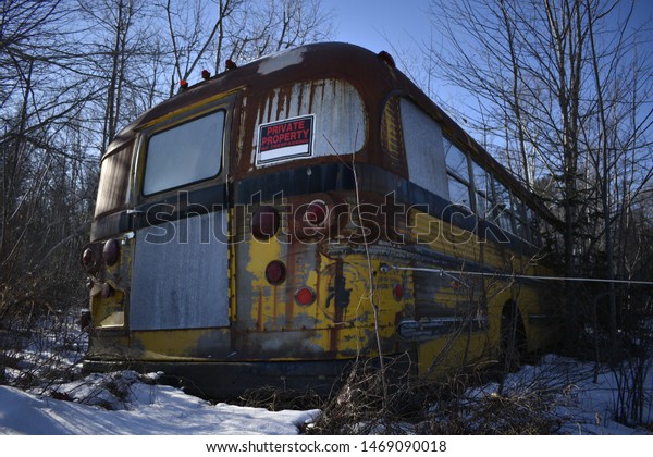 Broken Down School\
Bus Abandoned in the\
Snow