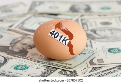 A Broken Egg With 401K Tag Sit on a Pile of Money