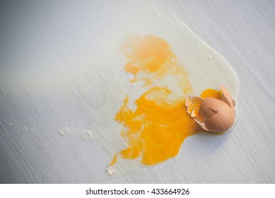 Broken Egg On Floor.