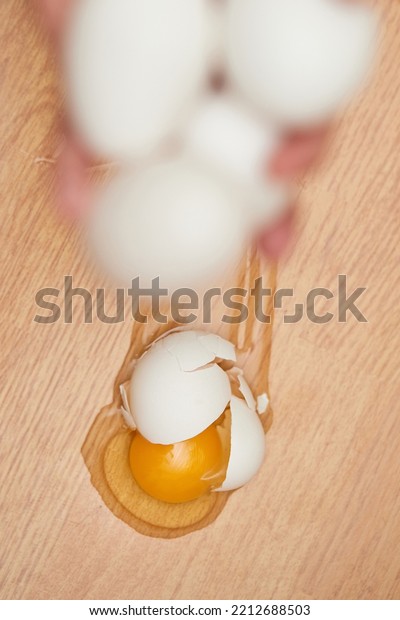 broken egg on the floor in\
kitchen