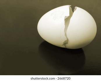 A Broken Egg Shell On Metallic Background With Reflection