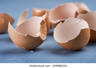 Broken Egg Shells On Blue Background