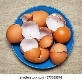 broken egg shells in a plate top view