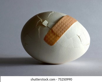 Broken Egg With Sticking Plaster