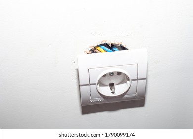 Broken Electric Socket Torn From White Wall. Fixing Loose Electrical Outlet Box