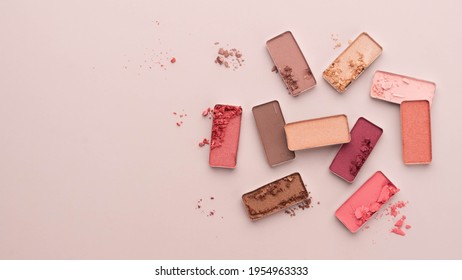 A Broken Eye Shadow Make Up Palette On A Beige Background. Beauty And Cosmetic Products Concept. Copy Space.