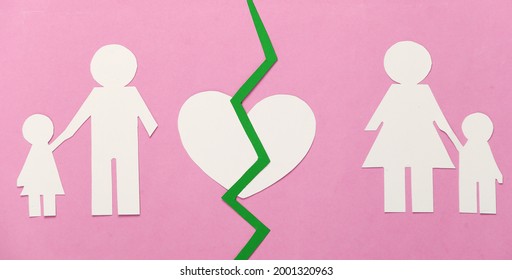 Broken Family, Divorce. Split Paper Family, Broken Heart On Pink Background