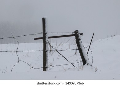 Broken Fence In The Snow