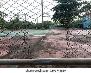 The Broken Fence Of A Tennis Court