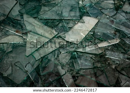 Broken flat glass panes in the recycling container