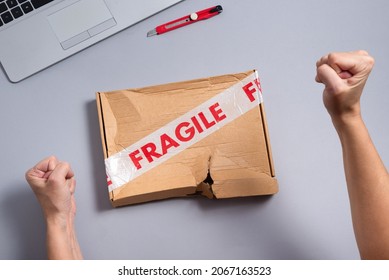 Broken Fragile Parcel, Torn Cardboard Box On Office Desk