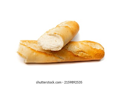 Broken French baguette isolated. Long bread loaf, two pieces of fresh cereal bun, traditional wheat baguette on white background
