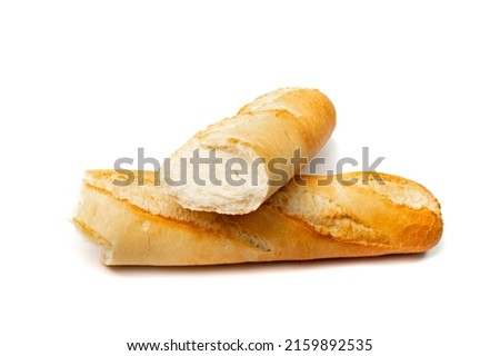 Broken French baguette isolated. Long bread loaf, two pieces of fresh cereal bun, traditional wheat baguette on white background